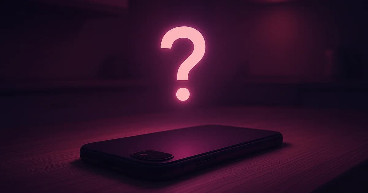 Phone face-down on a wooden table, soft kitchen light in the background